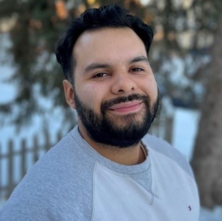 Image of Anthony Villagrana smiling while standing outside in the winter