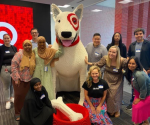 Step Up interns with Target team members and dog mascot sculpture at corporate headquarters