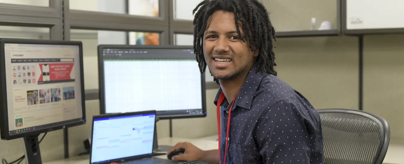 Intern at office desk at Xcel Energy 