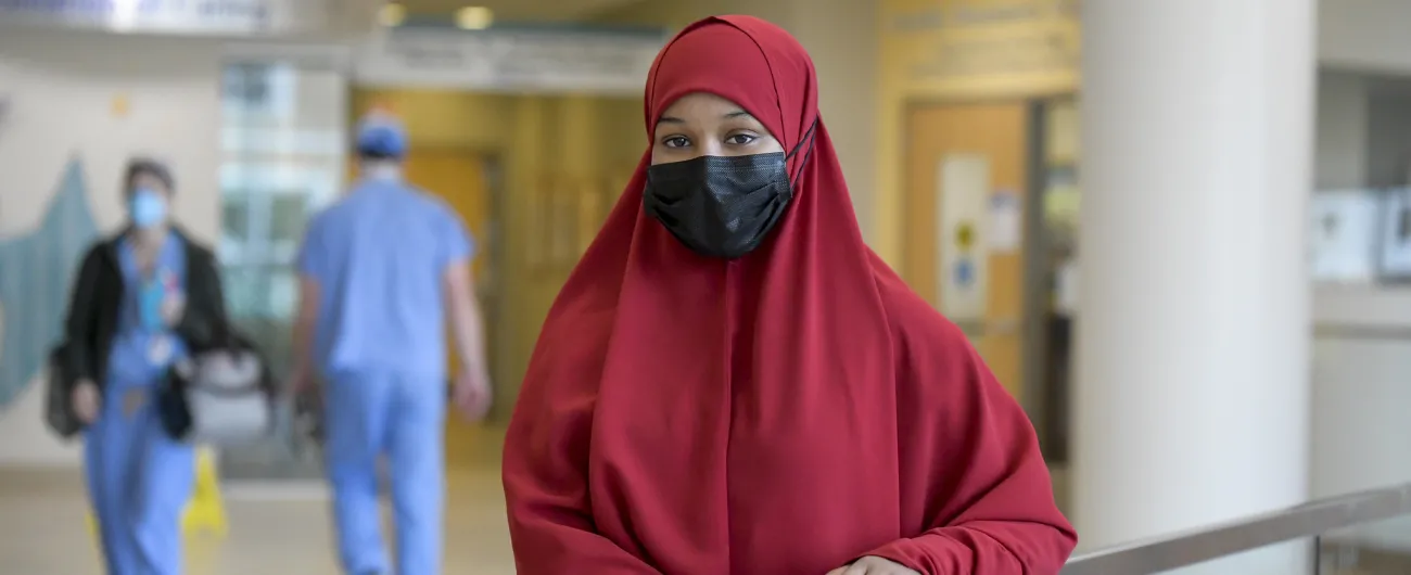College intern in hospital lobby 