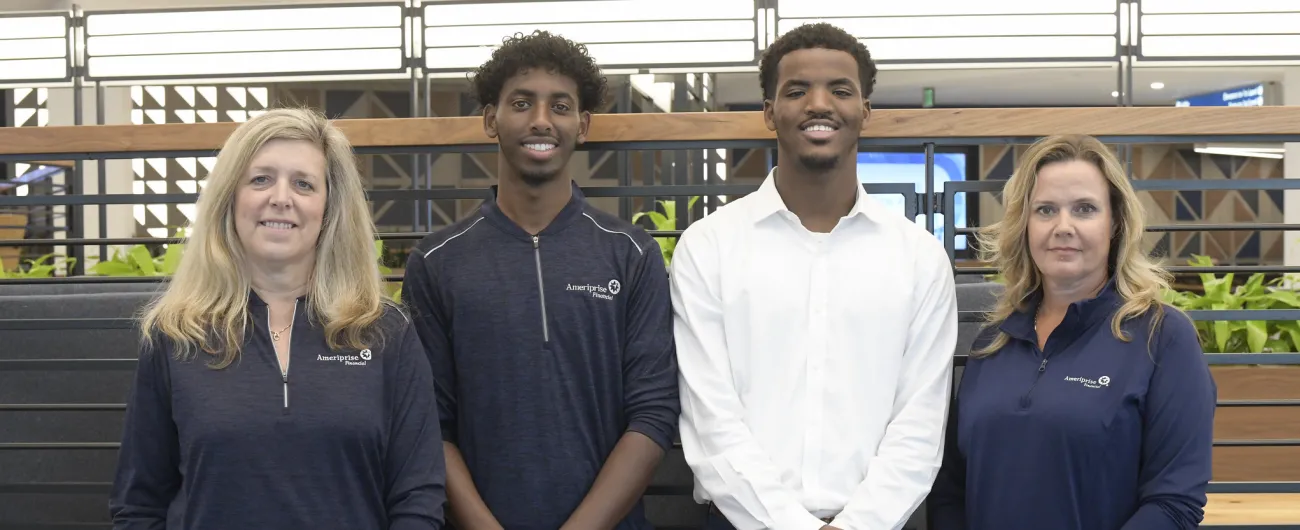 Amerirprise interns and supervisors in office 