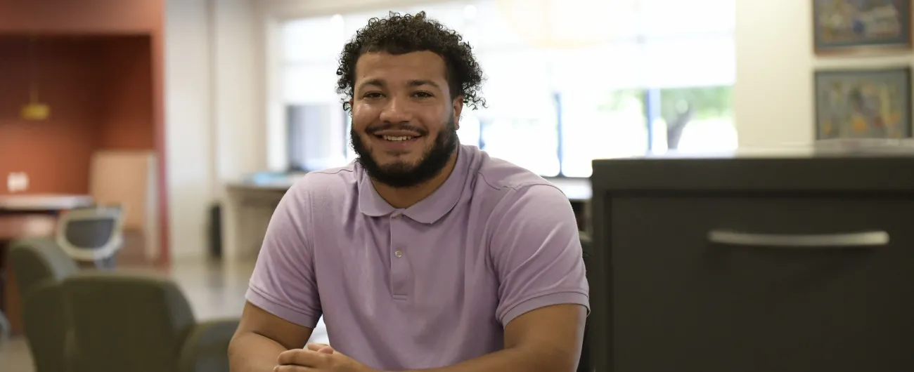 Intern sitting at office table 