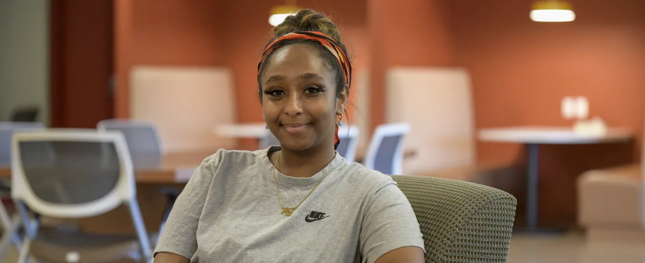 Intern sitting in office chair 