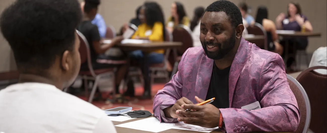 Volunteer in purple blazer