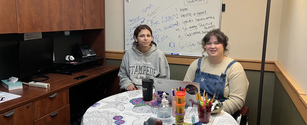 Achieve coordinator with student at Loring Nicollet school