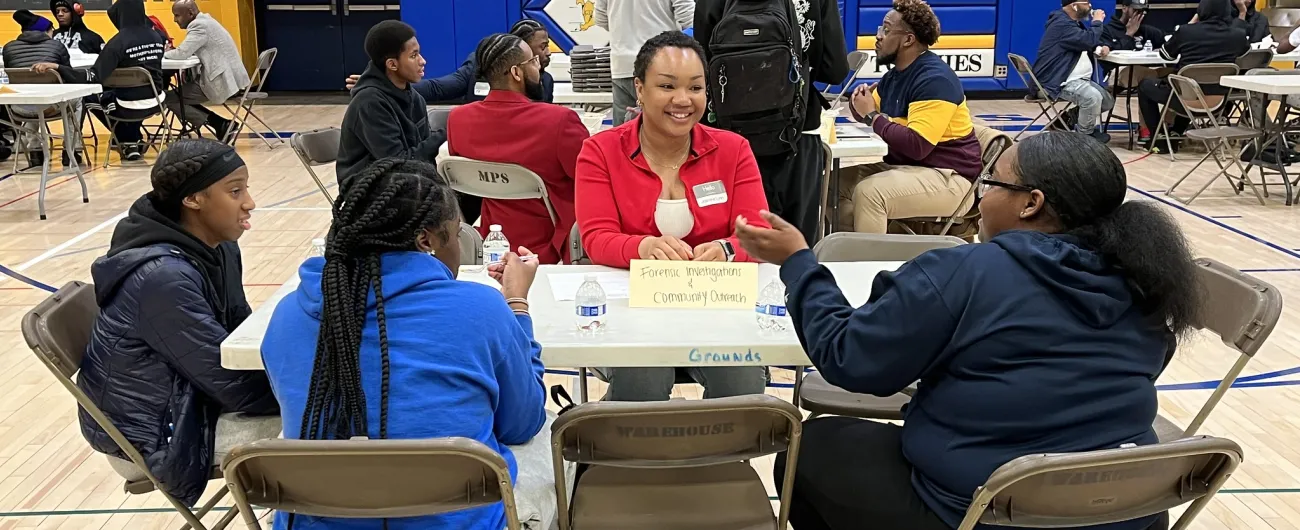 Edison volunteer with red sweater