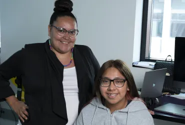 Adult and student together in an office 